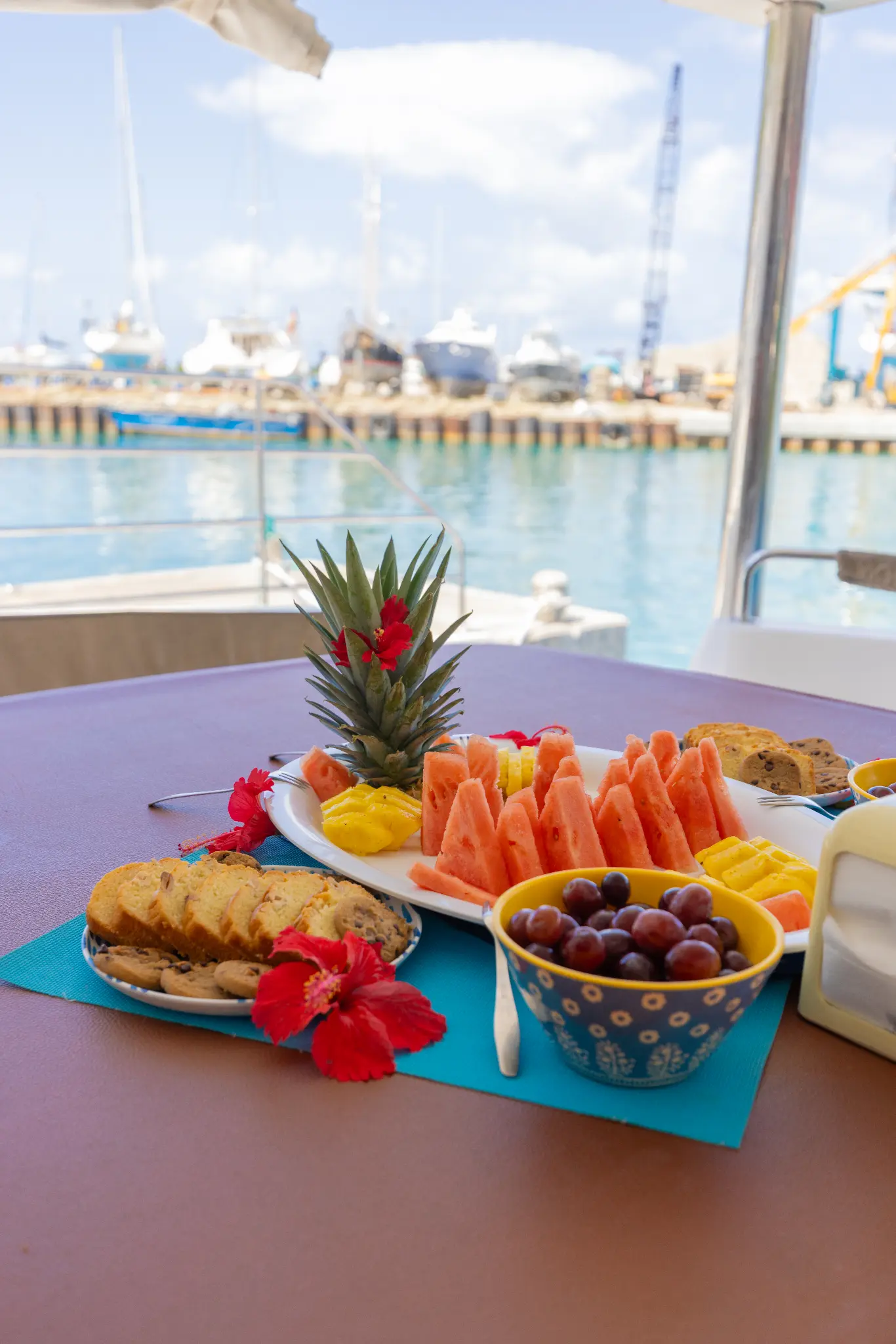 Freshly prepared tropical fruit platter with watermelon, pineapple and grapes aboard The Phoenix