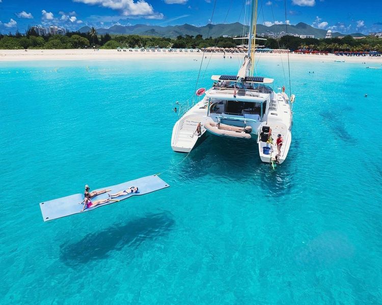 Guests aboard Sail The Phoenix enjoying the Caribbean day