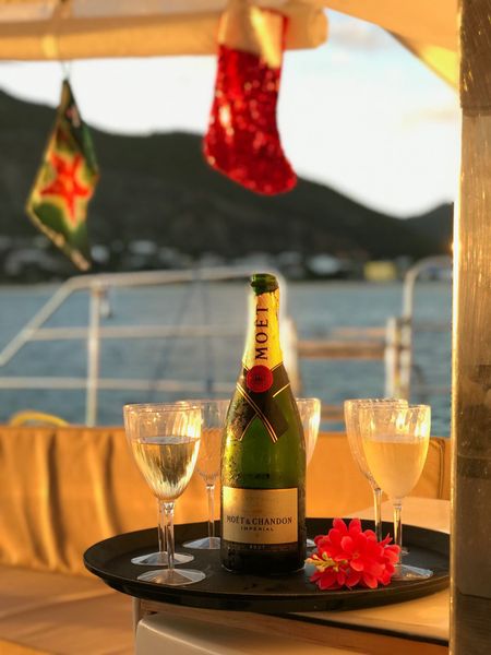 Moët & Chandon bottle on a table aboard Sail The Phoenix with filled flutes