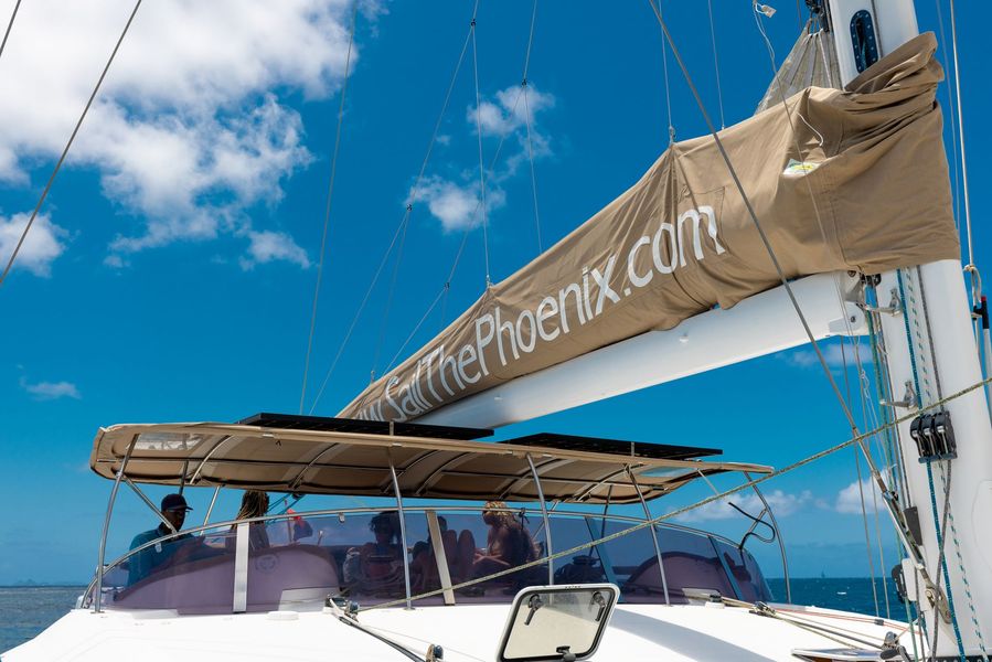 Sail The Phoenix catamaran sailing the St. Maarten coastline under full sail