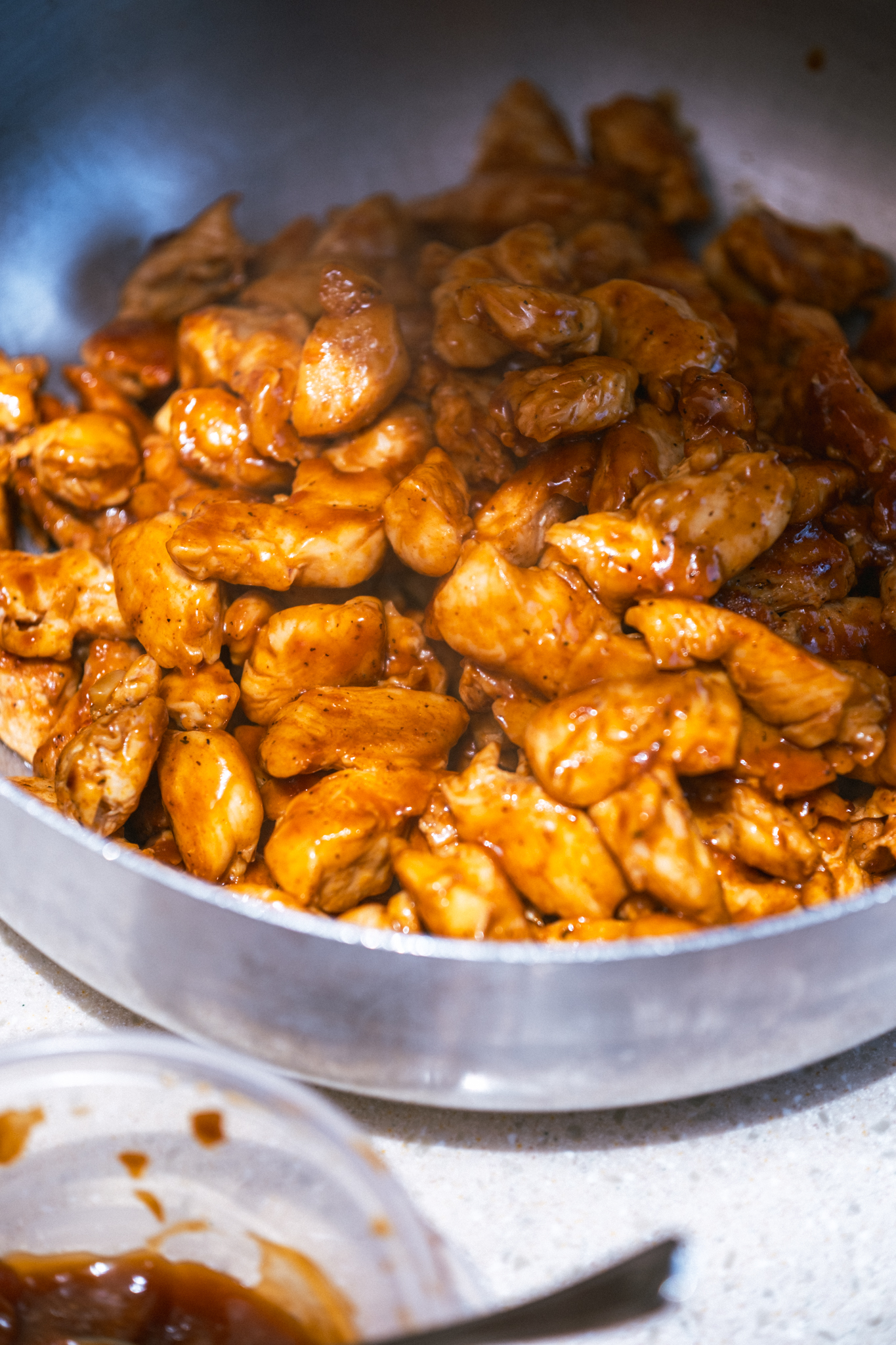 Freshly cooked glazed chicken in a pan in The Phoenix galley kitchen